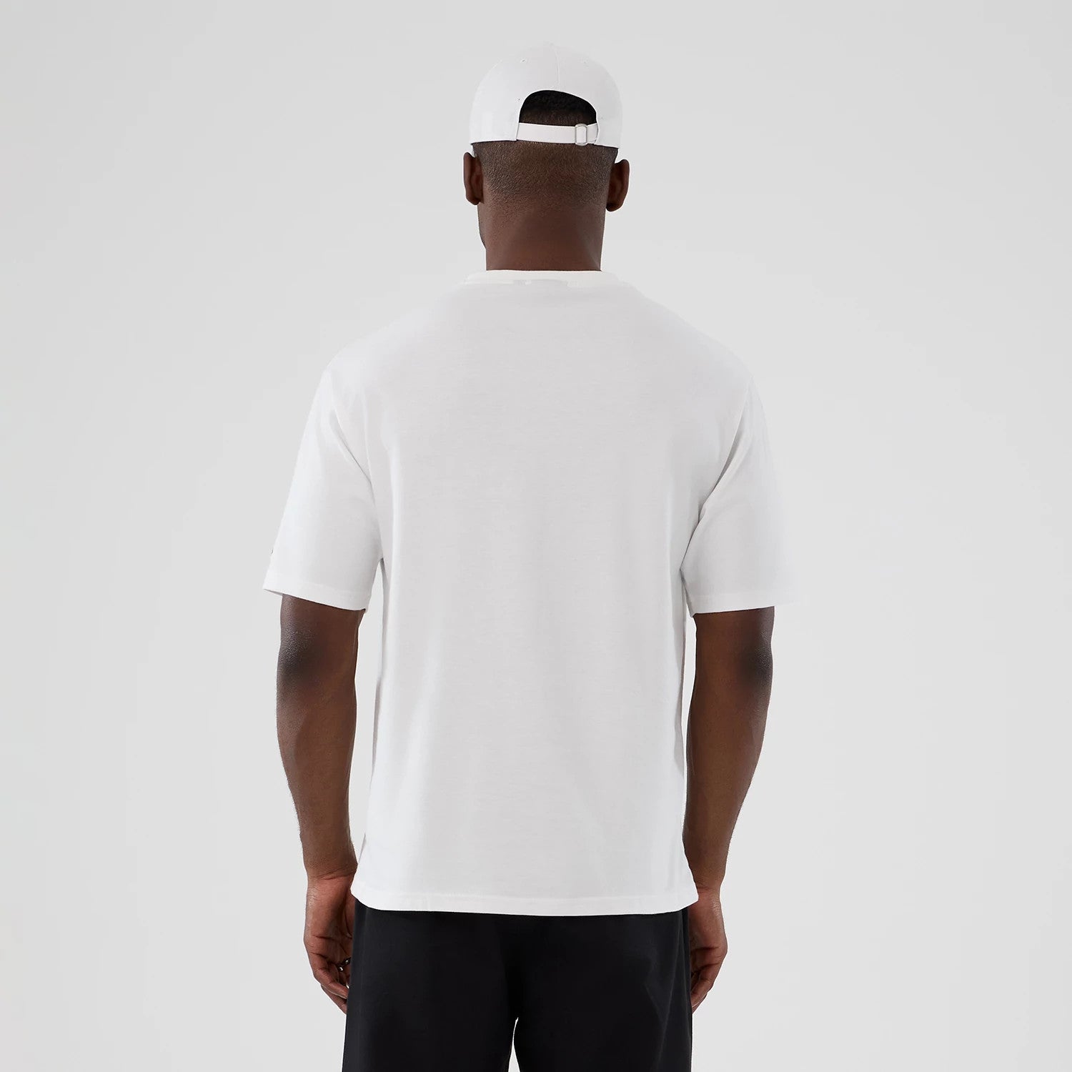The Male model is wearing New Era Halloween Skull Graphic White Oversized T-Shirt 2