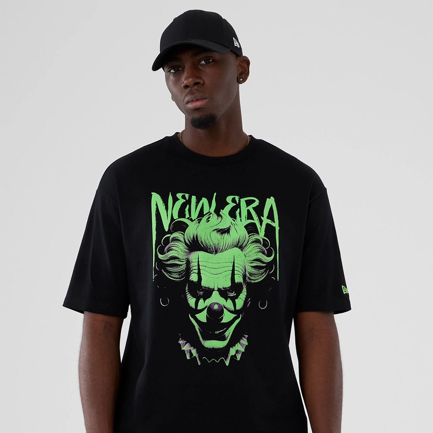 The Male model is wearing New Era Halloween Clown Graphic Black Oversized T-Shirt 7