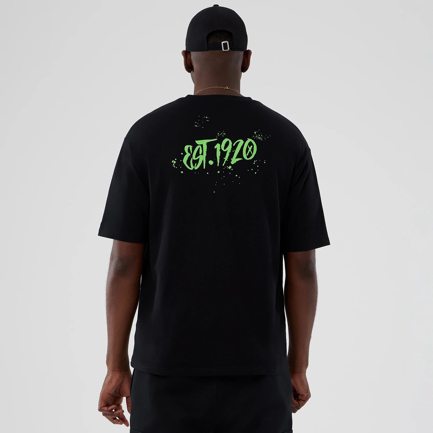 The Male model is wearing New Era Halloween Clown Graphic Black Oversized T-Shirt 2