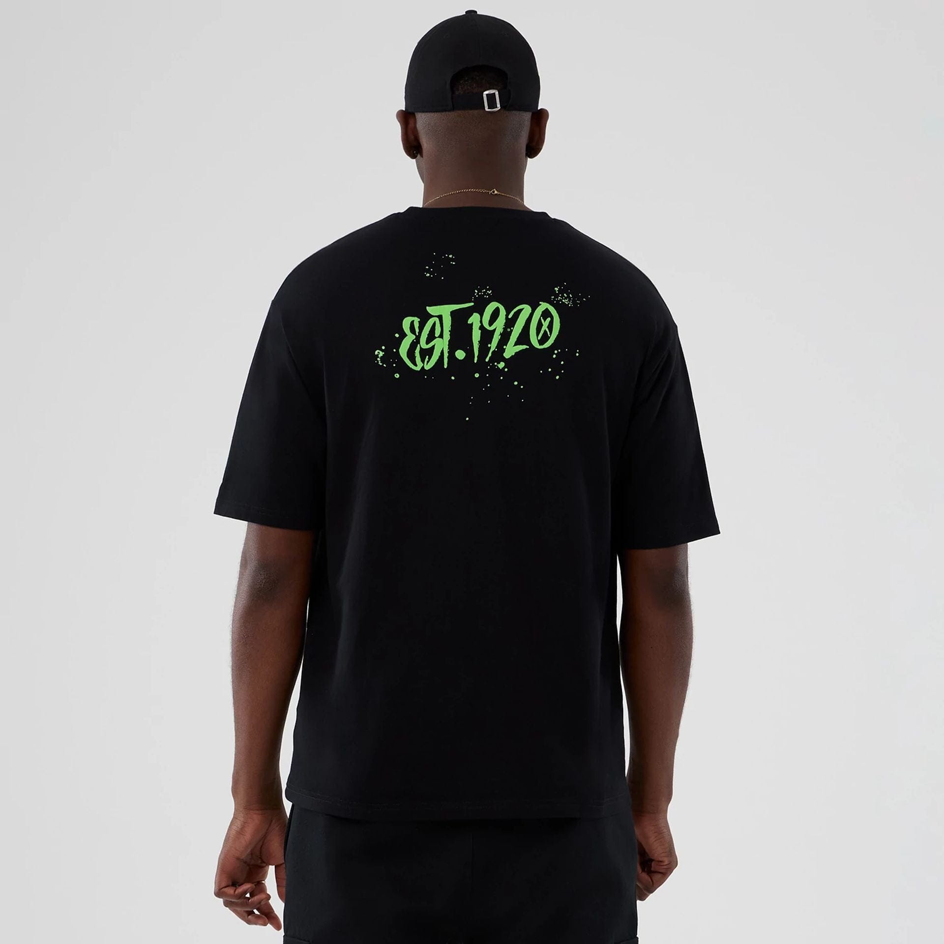 The Male model is wearing New Era Halloween Clown Graphic Black Oversized T-Shirt 2