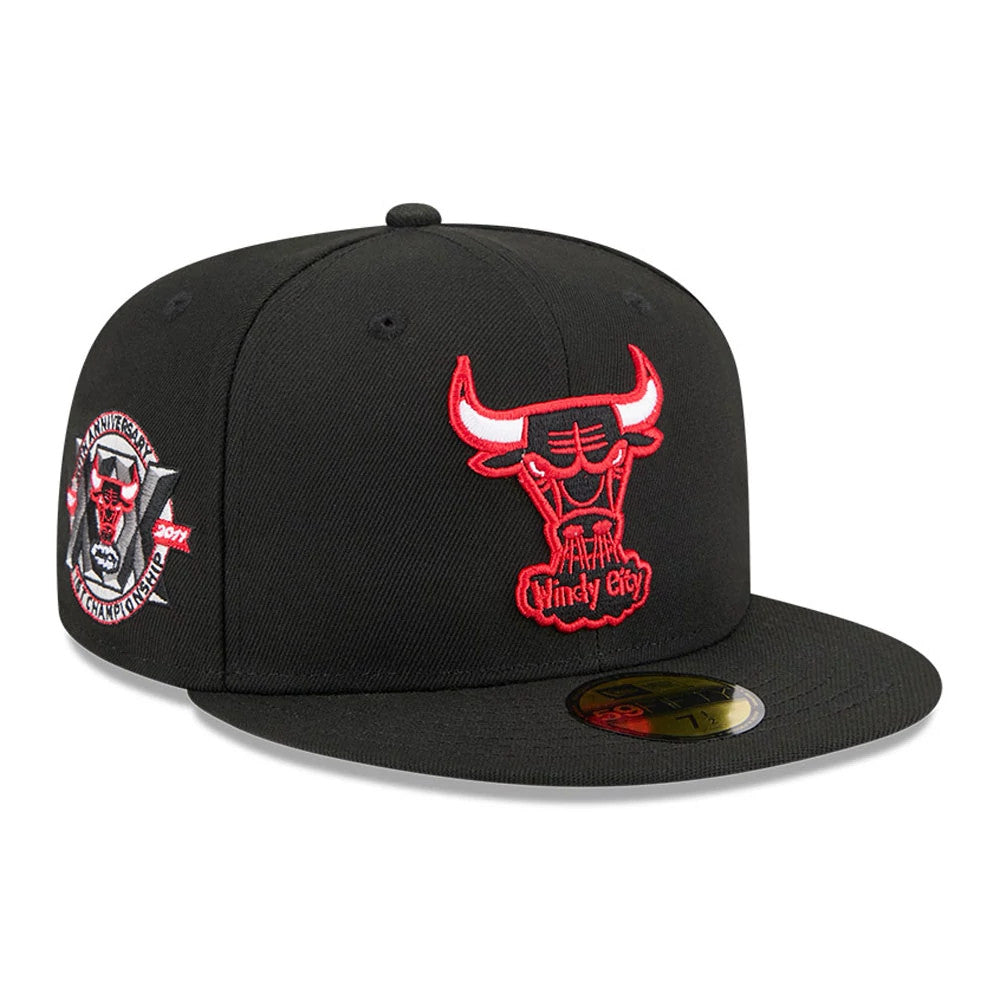 Chicago Bulls NBA Hardwood Classic Black New Era 59FIFTY Fitted Cap, three-quarter view showing a red raised embroidered Bulls logo on the front panel, a commemorative side patch, and a gold 59FIFTY size sticker on the black flat visor.