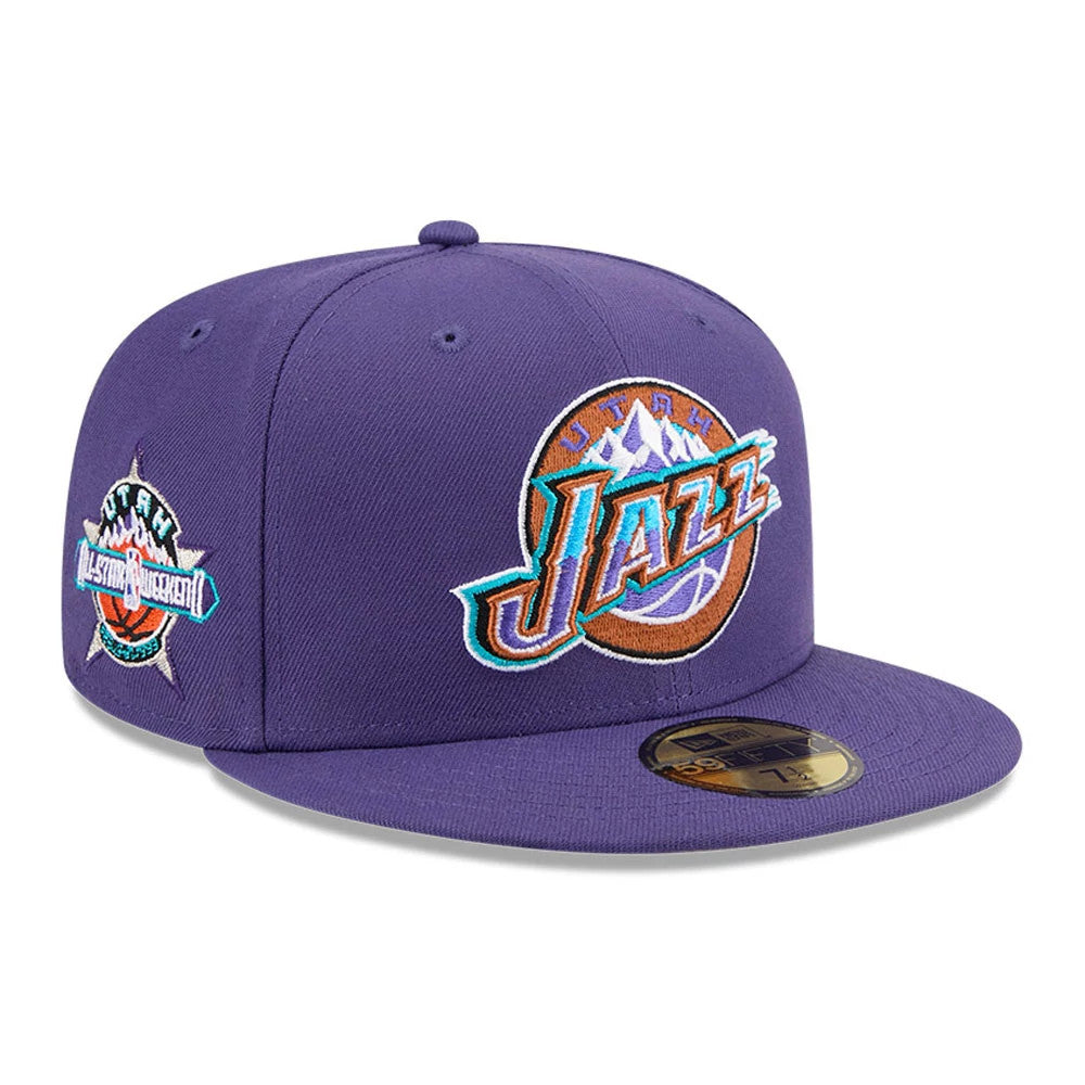 Utah Jazz NBA Hardwood Classic Dark Purple New Era 59FIFTY Fitted Cap, three-quarter view showing the raised embroidered Jazz logo on the front panel, the Utah All-Star Weekend logo on the side.
