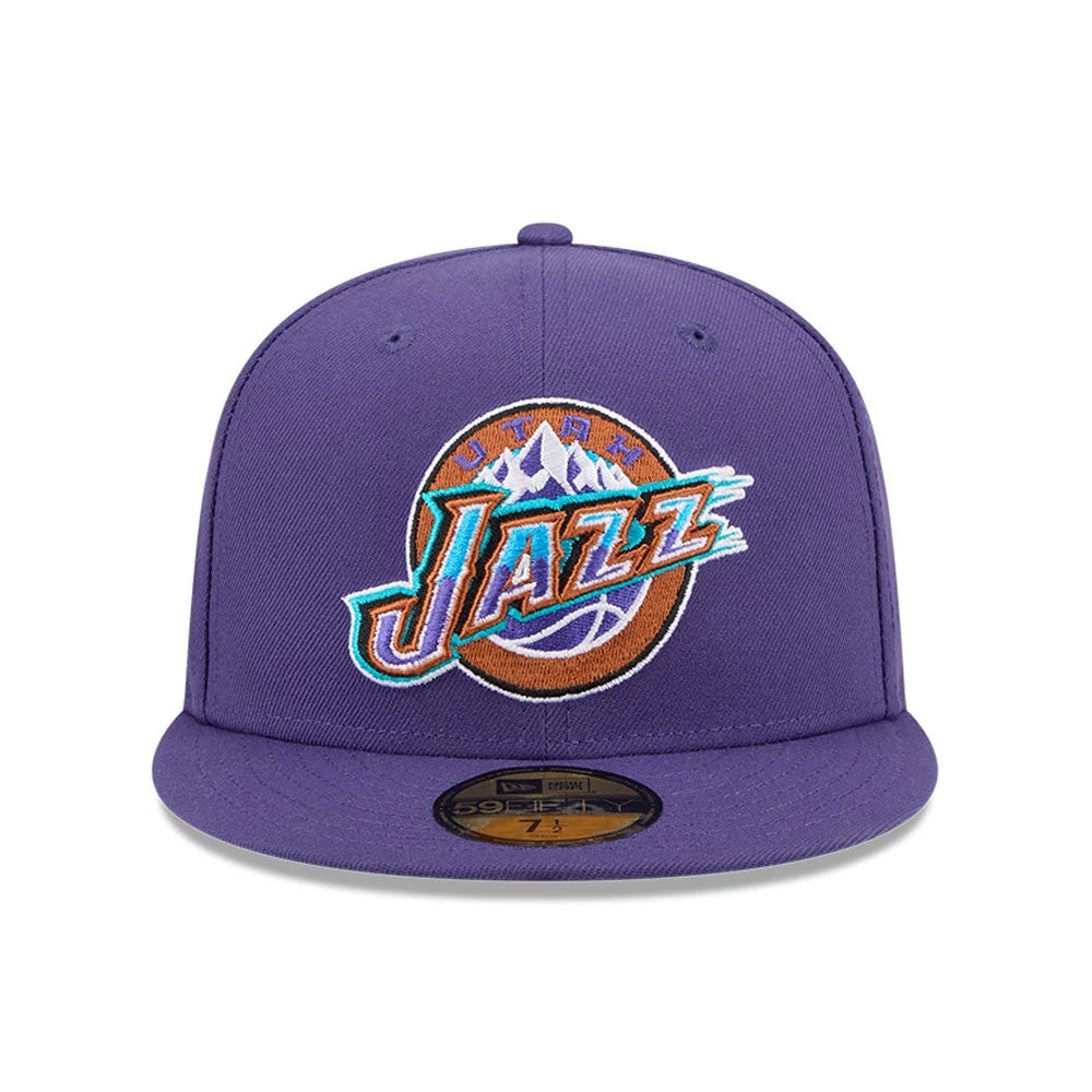 Utah Jazz NBA Hardwood Classic Dark Purple New Era 59FIFTY Fitted Cap, front view featuring the multicolour embroidered Jazz logo on the front panel, a flat dark purple visor, and a gold 59FIFTY size sticker on the visor.