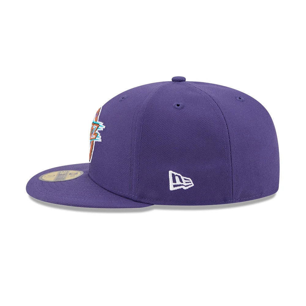 Utah Jazz NBA Hardwood Classic Dark Purple New Era 59FIFTY Fitted Cap, side view with the white embroidered New Era flag logo on the left side, showing the structured crown and flat visor with a gold 59FIFTY size sticker on top.
