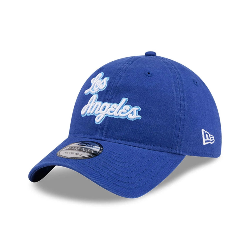LA Lakers NBA Hardwood Classic Blue New Era 9TWENTY Adjustable Cap, front view showing the white raised script Los Angeles embroidery on the structured blue crown with a curved visor and 9TWENTY size sticker, and New Era flag logo on the left side.
