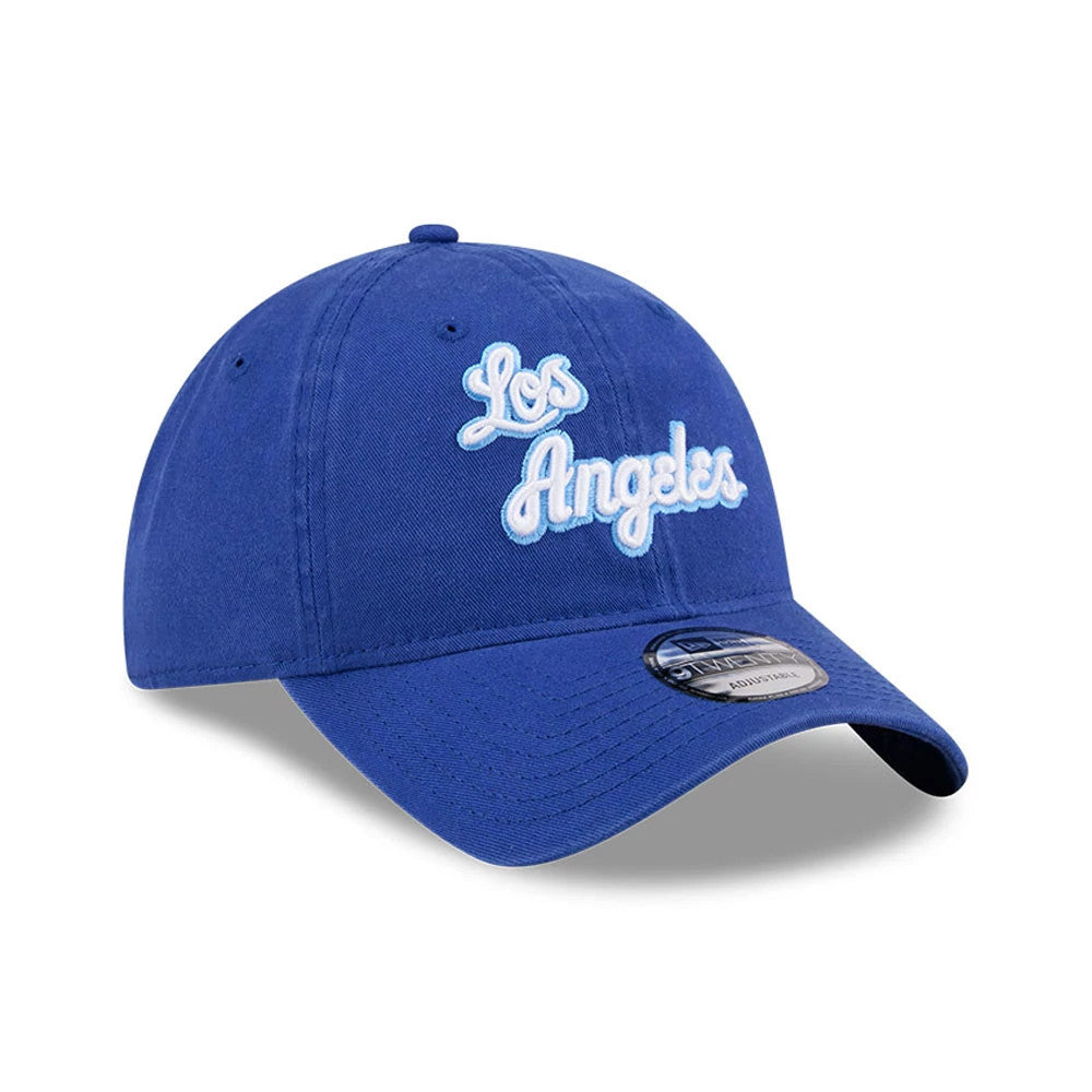 LA Lakers NBA Hardwood Classic Blue New Era 9TWENTY Adjustable Cap, three-quarter view showing white Los Angeles script embroidery on front panels, a curved blue visor with a 9TWENTY size sticker, and a matching top button and eyelets.