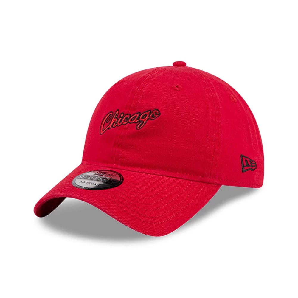 Chicago Bulls NBA Hardwood Classic Red New Era 9TWENTY Adjustable Cap, three-quarter view showing the black embroidered Chicago script logo on the front panel, curved red visor with 9TWENTY size sticker, and black New Era flag on the left side.