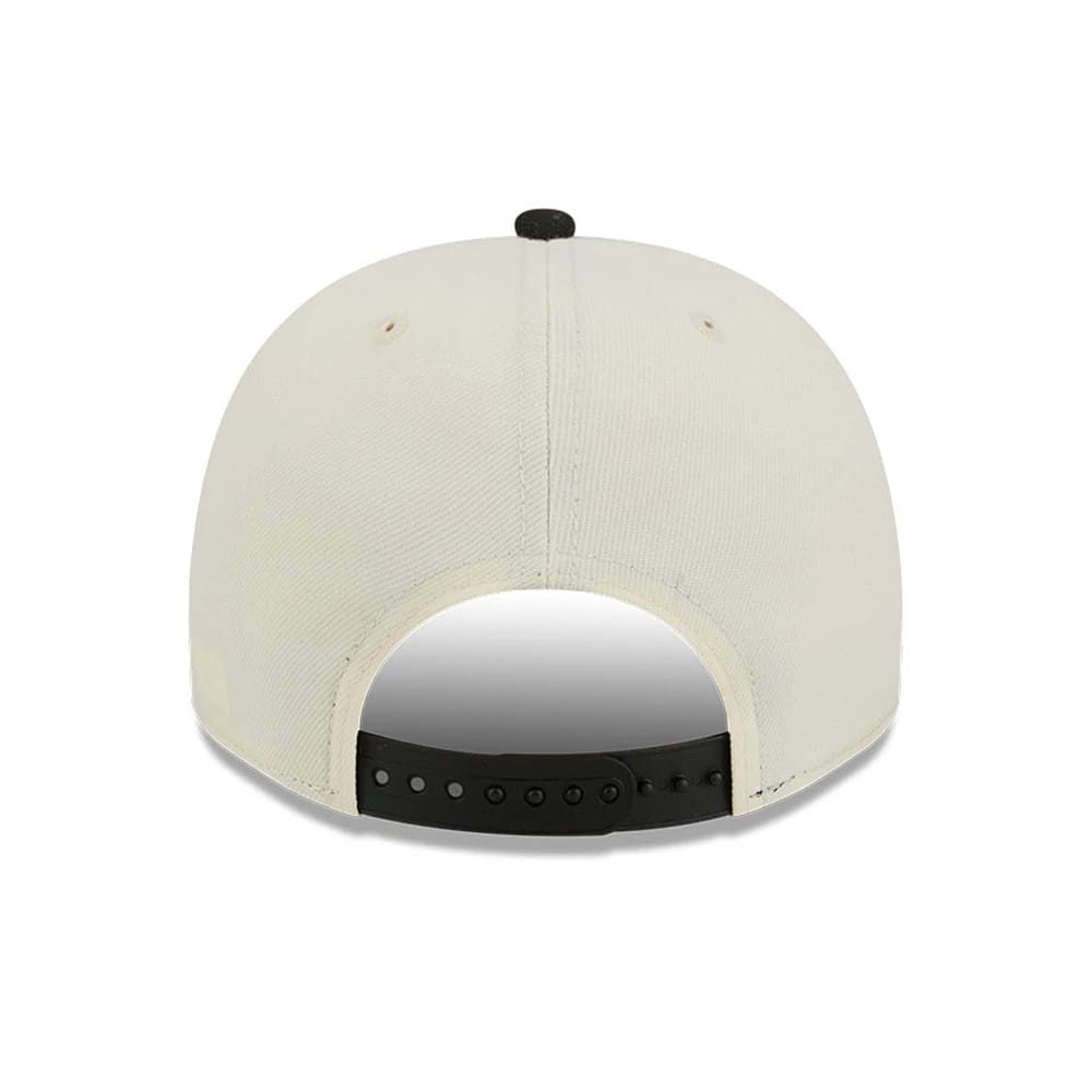 Pictured is this NBA Hardwood Classic Toronto Raptors 9FIFTY A-Frame Snapback cap in Cream 7