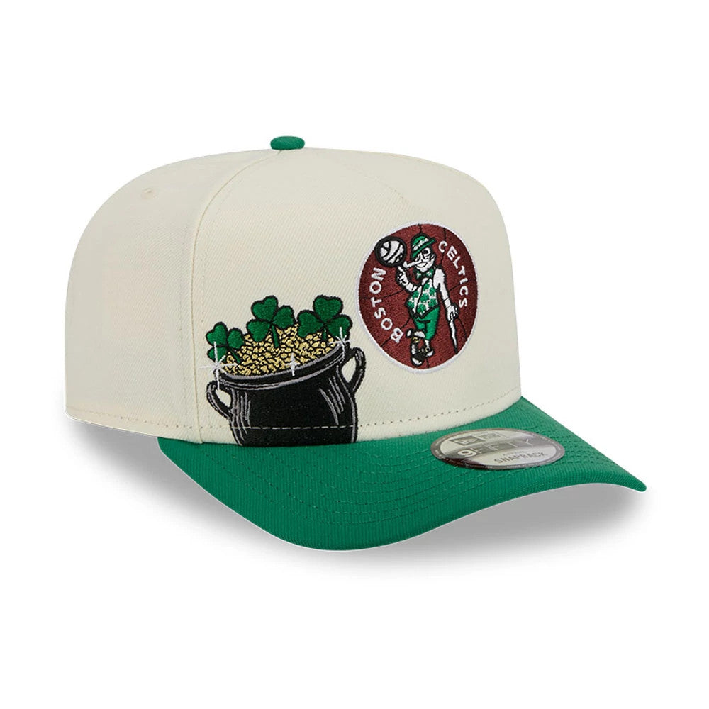 Boston Celtics NBA Cream New Era 9FIFTY A-Frame Snapback Adjustable Cap, three-quarter view showing a black pot of gold embroidered on the front panels, the Celtics mascot logo patch, and a green flat visor with a 9FIFTY size sticker.