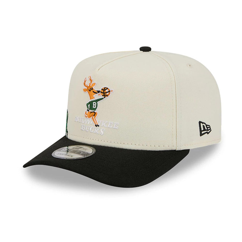 Milwaukee Bucks NBA Black New Era 9FIFTY A-Frame Snapback Adjustable Cap, three-quarter view showing the team logo with a deer in a green jersey and orange details embroidered on the front panel, black flat visor, and size sticker.