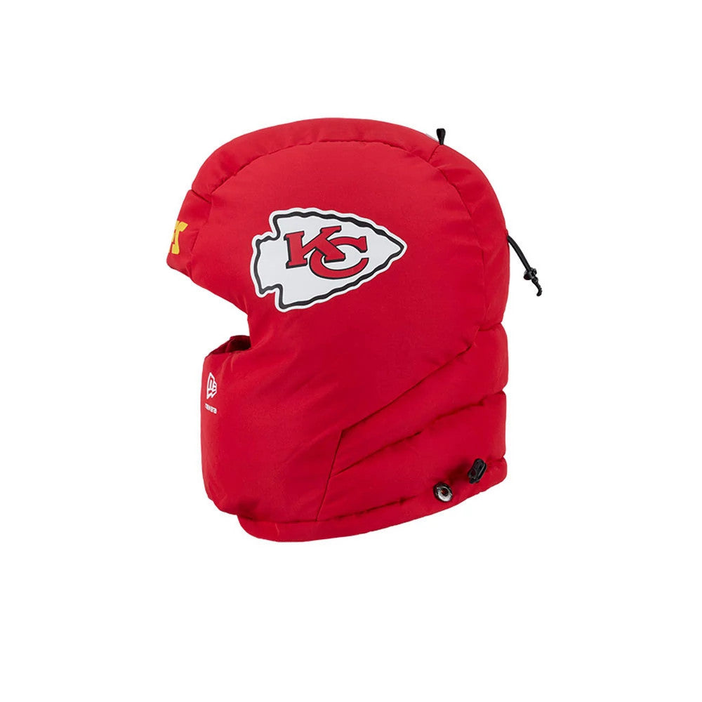 New Era Kansas City Chiefs NFL Puffer Helmet Red Trapper Hat, side view showing the Chiefs logo embroidered on the red puffer exterior, with a drawstring cord and a small New Era flag logo on the side flap.