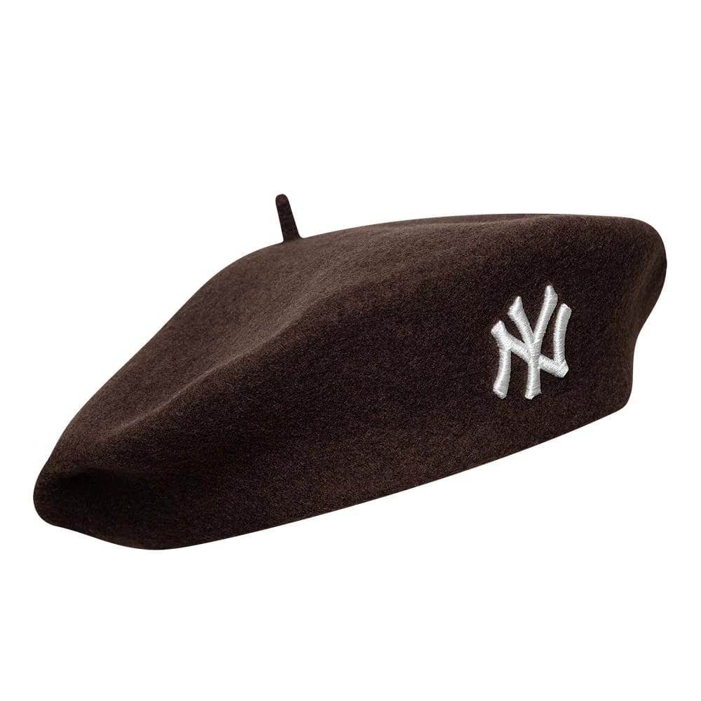 New Era New York Yankees Womens MLB Wool Dark Brown Beret, three-quarter view showing the white embroidered NY logo on the front, with a classic beret shape and soft wool texture in rich dark brown.