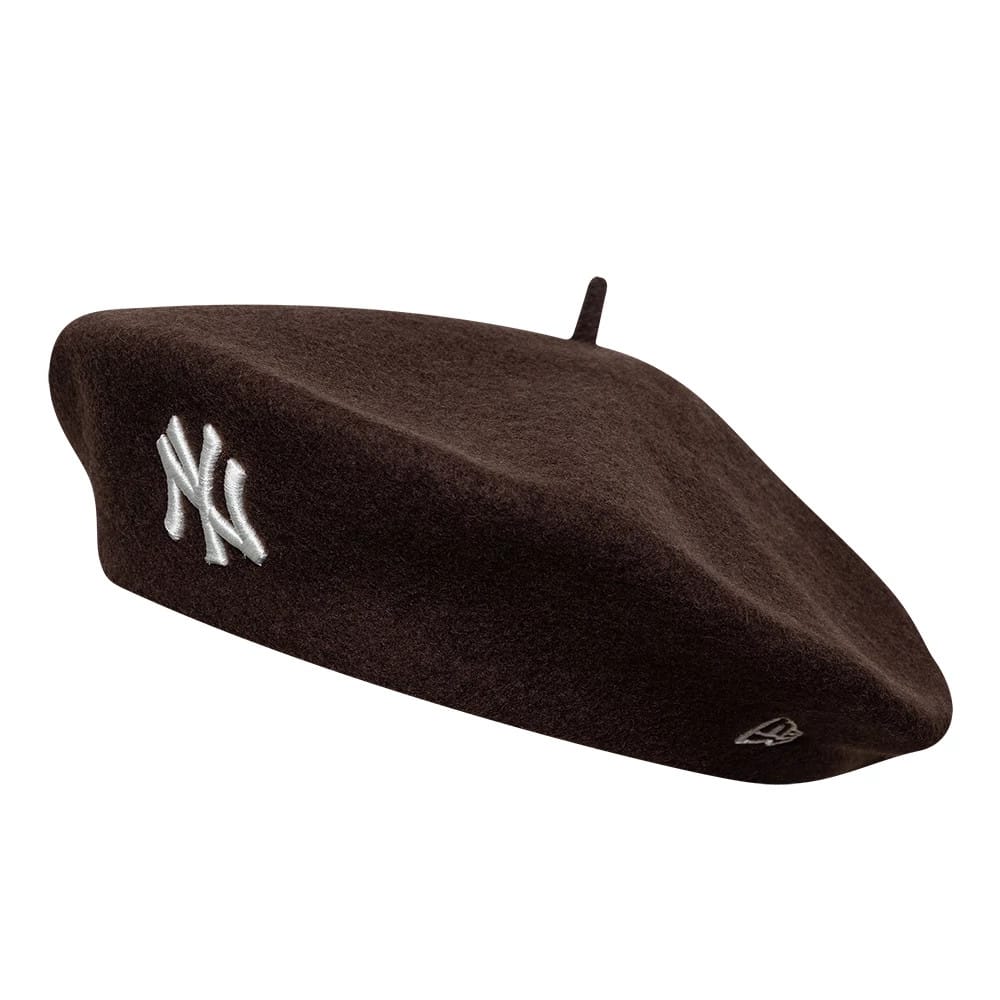 New Era New York Yankees Womens MLB Wool Dark Brown Beret, side view showing the silver embroidered NY logo on the front and the New Era flag logo on the side, with a classic dark brown wool structure.