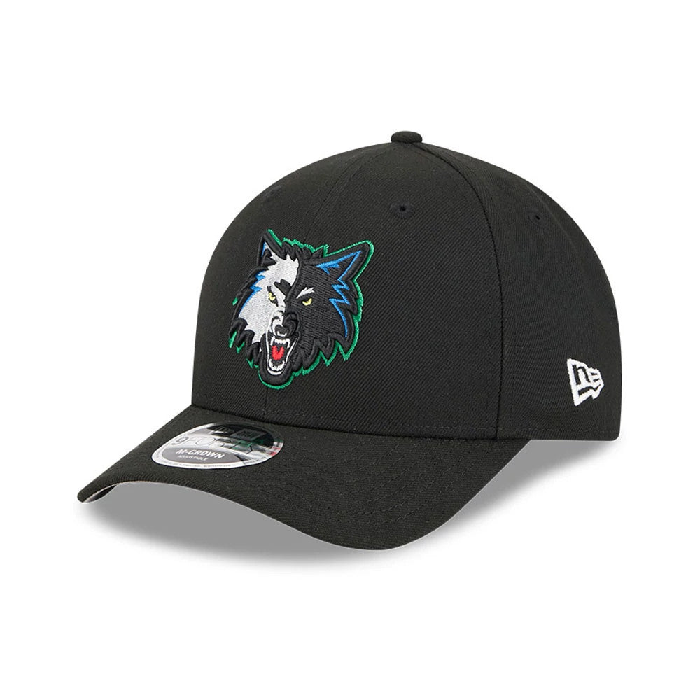 Minnesota Timberwolves NBA Classic Black New Era 9FORTY M-Crown Adjustable Cap, three-quarter view showing the raised embroidered Timberwolves logo on the front panel, curved black visor, and 9FORTY size sticker.
