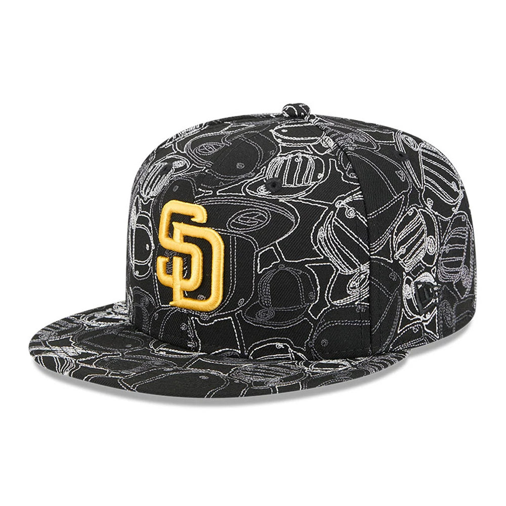 San Diego Padres MLB Cap Scramble Black New Era 59FIFTY Fitted Cap, three-quarter view showing raised gold SD logo on black crown with white cap illustration graphics, flat visor and embroidered eyelets.