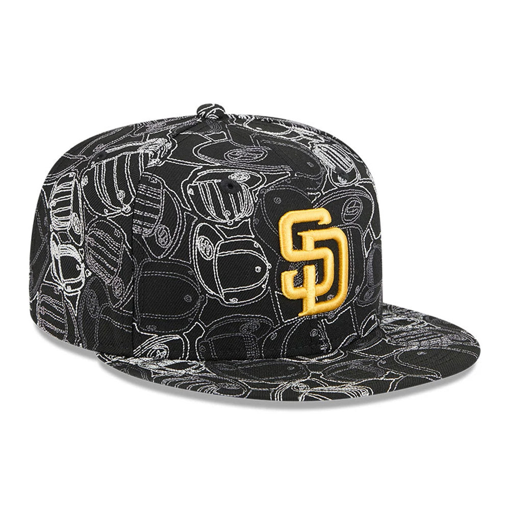 San Diego Padres MLB Cap Scramble Black New Era 59FIFTY Fitted Cap, three-quarter view showing the raised gold SD logo on the front panel, with a black flat visor and a detailed white scramble pattern across the crown and visor.
