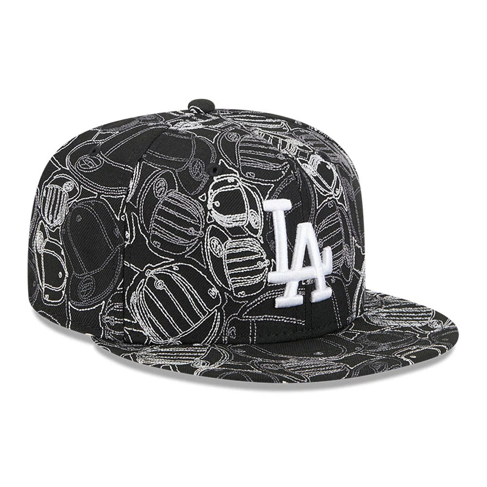 LA Dodgers MLB Cap Scramble Black New Era 59FIFTY Fitted Cap, front view showing the raised white LA logo embroidered on the front panel, with a black visor featuring an intricate cap pattern in contrasting white.