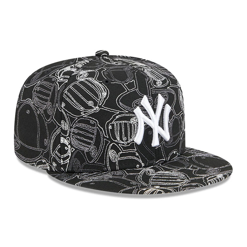 New York Yankees MLB Cap Scramble Black New Era 59FIFTY Fitted Cap, three-quarter view showing a raised white NY logo embroidered on the front panel, with a black visor and an intricate cap scramble pattern in grey across the entire crown.