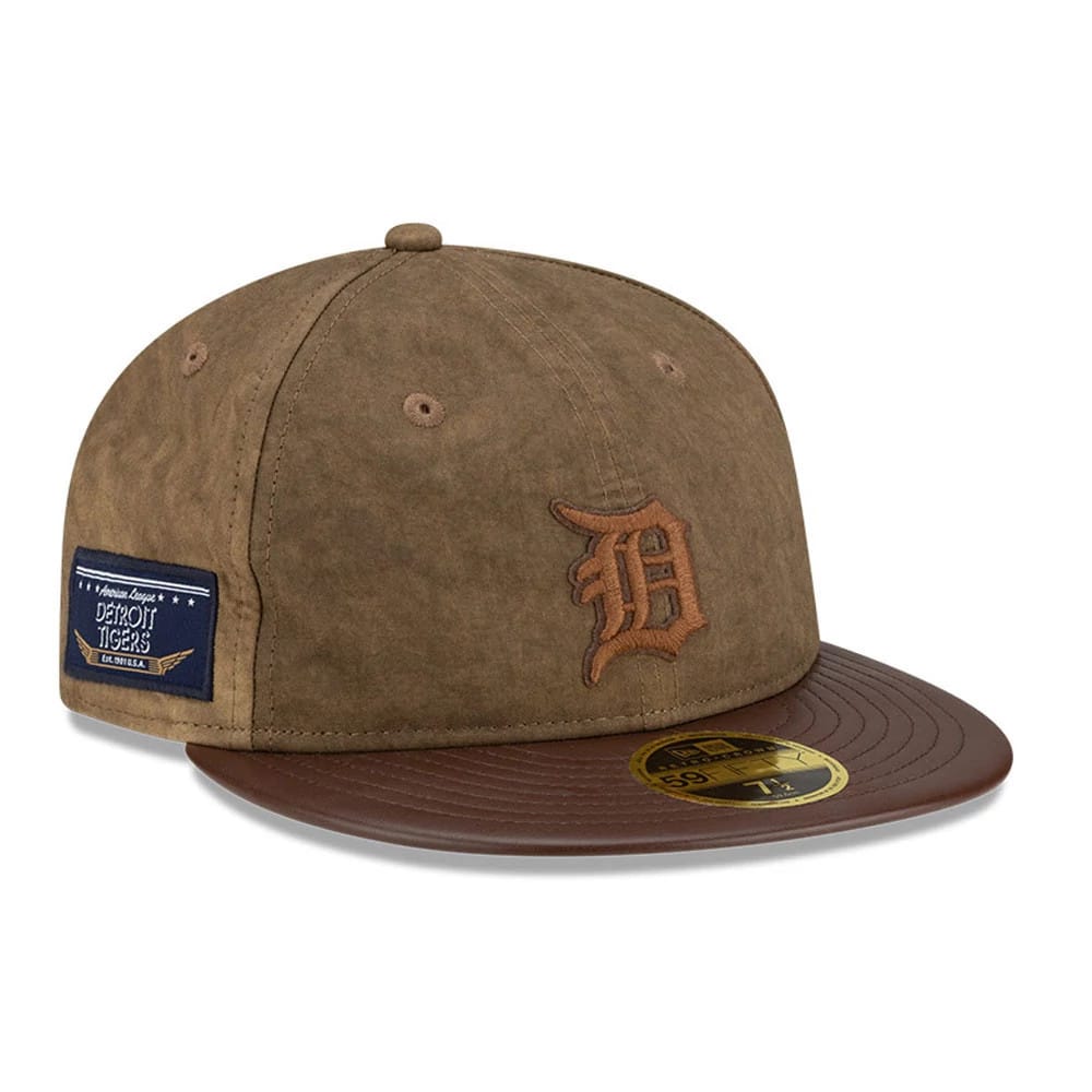 Detroit Tigers MLB Open Brown Retro Crown New Era 59FIFTY Fitted Cap, three-quarter view showing the raised brown embroidered D logo on the front panel, a dark brown flat visor with a gold 59FIFTY size sticker, and a rectangular side patch.