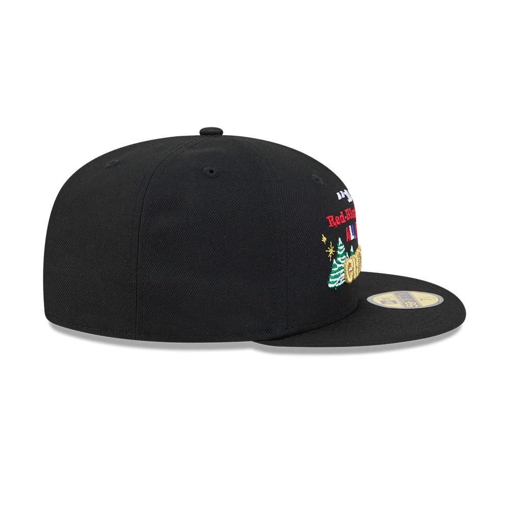A Christmas Story Warner Brothers Black New Era 59FIFTY Fitted Cap, side view showing embroidery of Christmas trees and festive lettering on the front panel, with a black flat visor and a gold 59FIFTY size sticker.