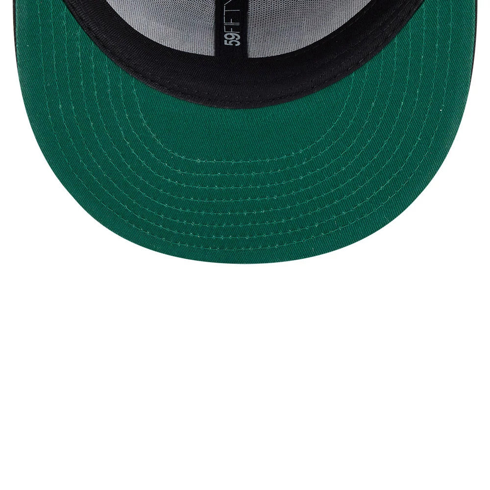 A Christmas Story Warner Brothers Black New Era 59FIFTY Fitted Cap, inside view showing the green undervisor, black sweatband with 59FIFTY branding on the taping and the structured crown.
