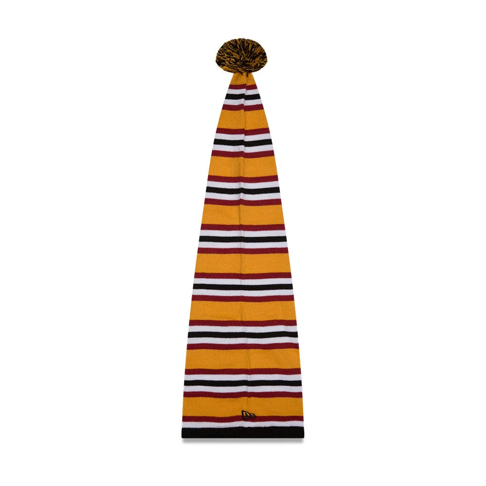 New Era A Christmas Story Warner Brothers Black Cuff Knit Beanie Hat, front view showing a tall knitted design with alternating mustard, white, black, and burgundy stripes, finished with a black cuff and a mustard and black pom-pom on top.