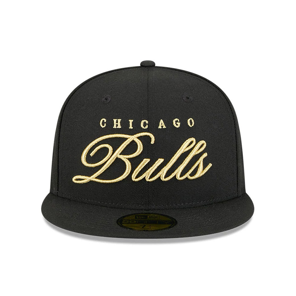 Chicago Bulls NBA All Star Game 2026 Black New Era 59FIFTY Fitted Cap, front view showing raised gold embroidery of Chicago Bulls lettering on the front panel, with a matching black flat visor and a gold 59FIFTY size sticker.