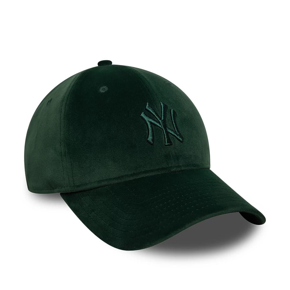 New York Yankees MLB Velour Dark Green New Era 9TWENTY Bow Back Adjustable Cap, three-quarter view showing the raised dark green NY embroidery on the front panel and a curved visor, with a dark green top button and eyelets.