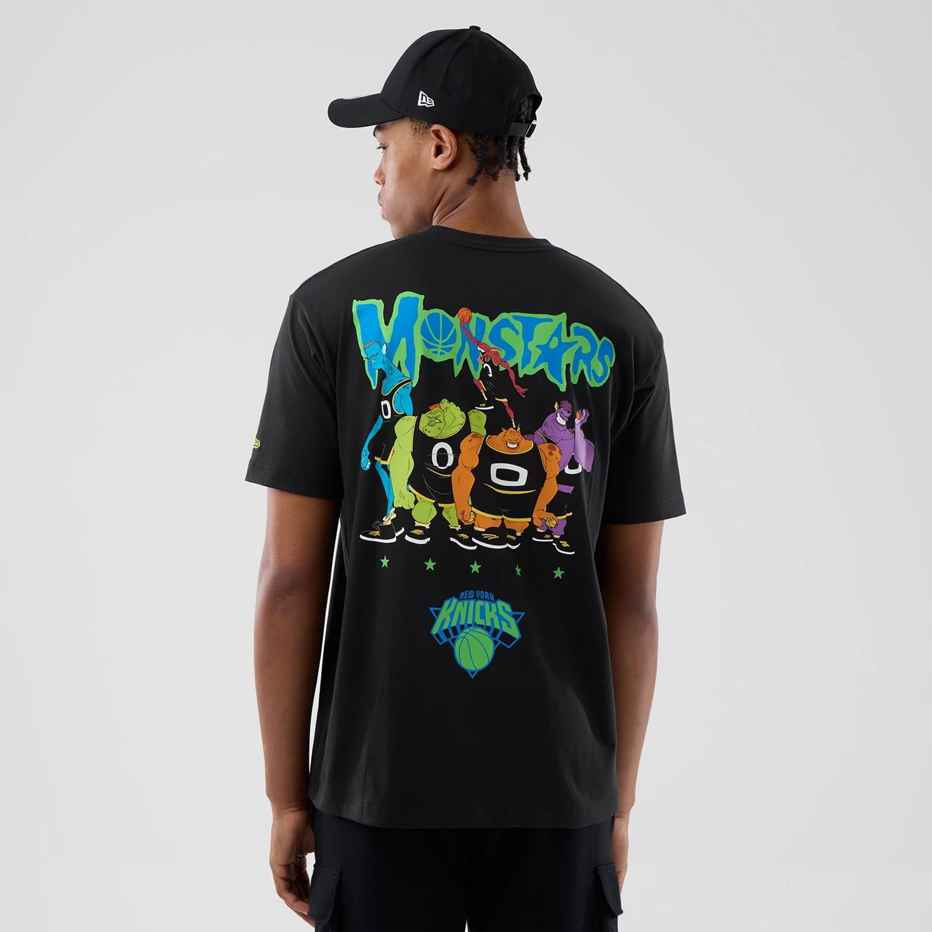 The model is wearing this Space Jam 2 X NBA New York Knicks T-Shirt in black. 2