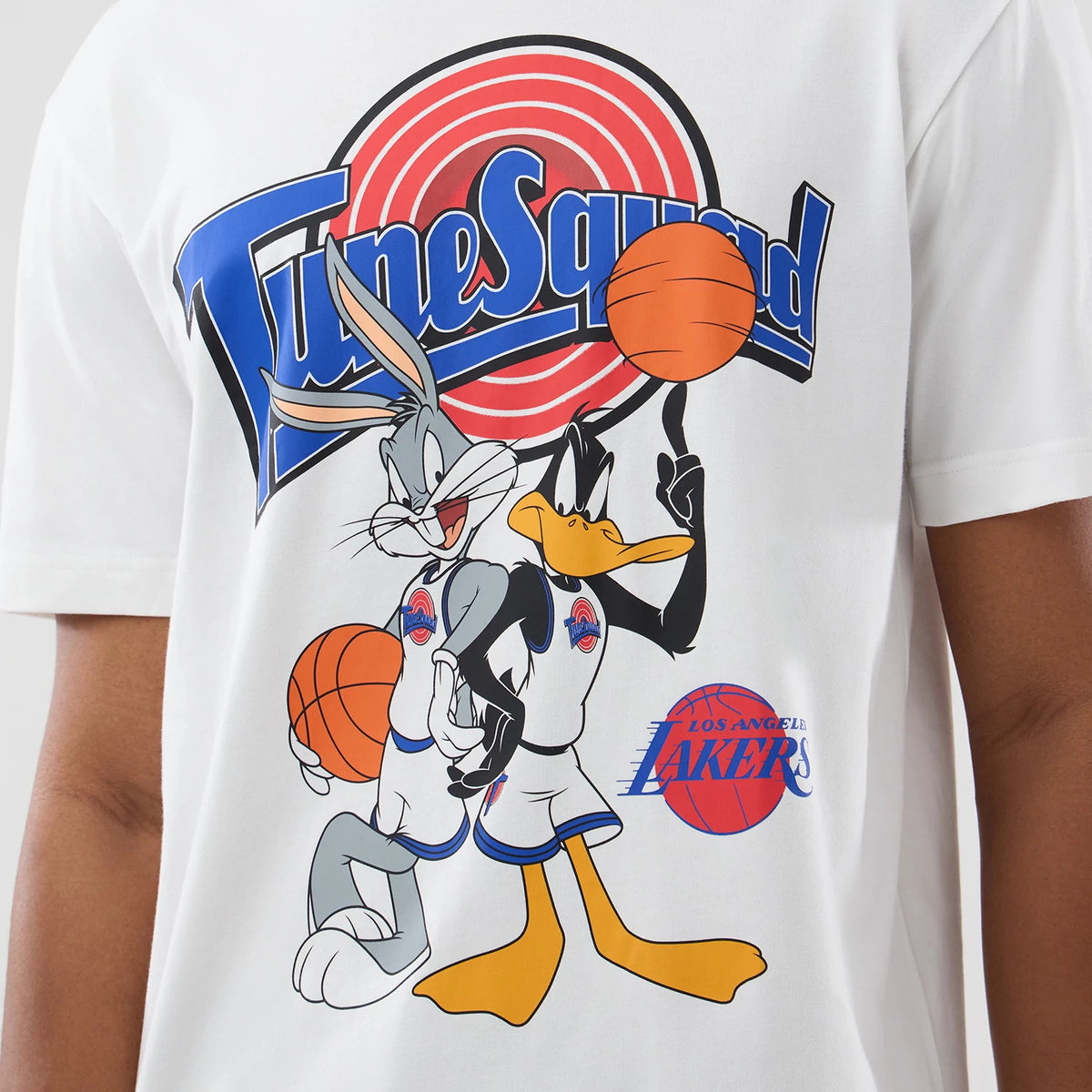 New Era LA Lakers Space Jam 2 X NBA White T-Shirt, front view showcasing a colourful printed graphic of Bugs Bunny and Daffy Duck with basketballs, the Tune Squad logo above and the Los Angeles Lakers logo to the side.