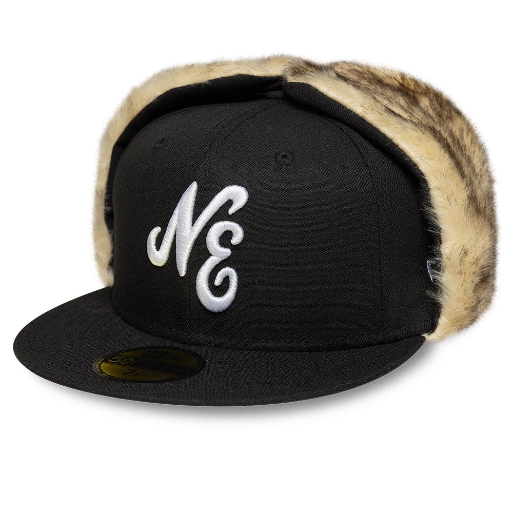 New Era Black Dogear 59FIFTY Fitted Cap, three-quarter view showing the white raised NE embroidery on the front panel, with black flat visor, gold 59FIFTY size sticker, and faux fur-lined ear flaps.
