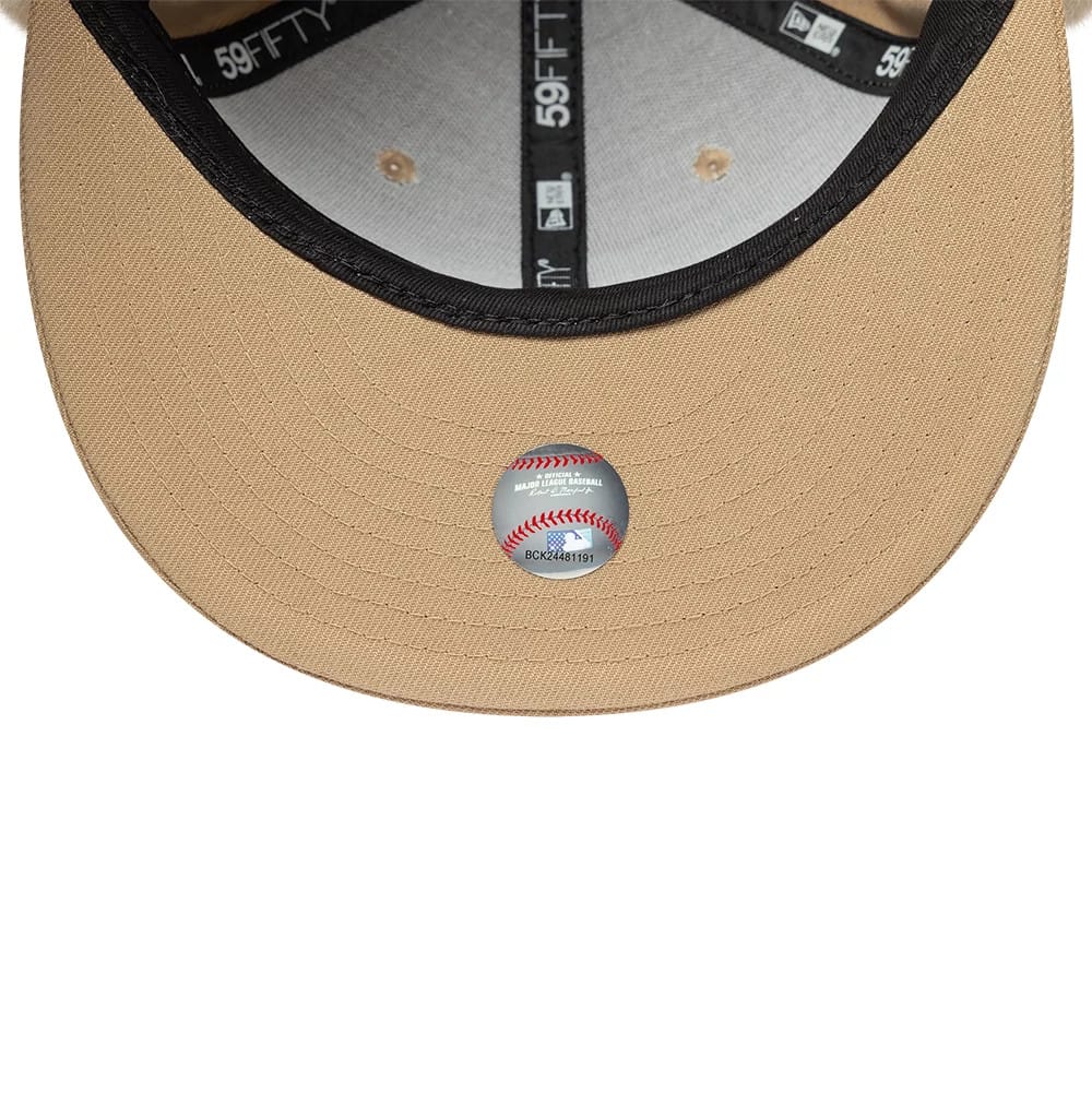 LA Dodgers MLB World Series Light Beige New Era Dogear 59FIFTY Fitted Cap, inside view showing a grey undervisor, black taping with 59FIFTY branding and a Major League Baseball size sticker on the beige fabric.