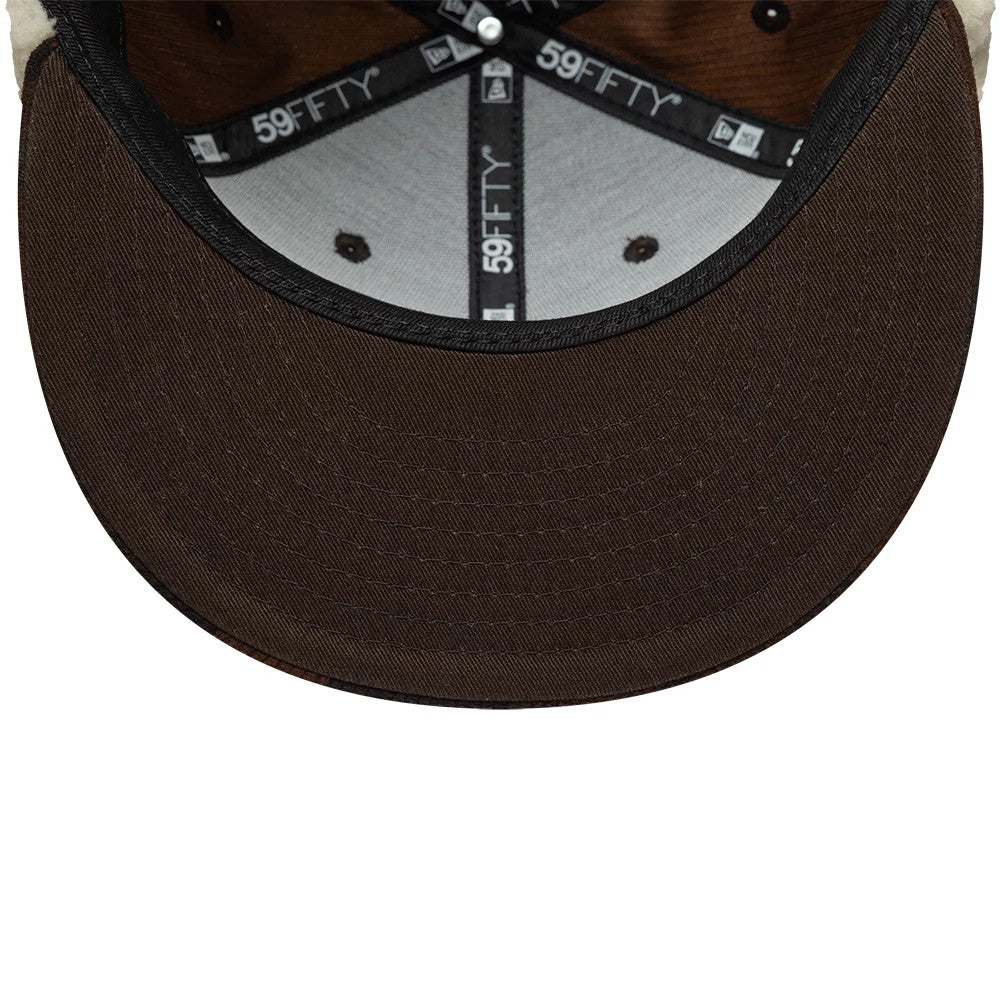 Pictured is this New Era Cord Downflap 59FIFTY Fitted cap in dark brown. 11