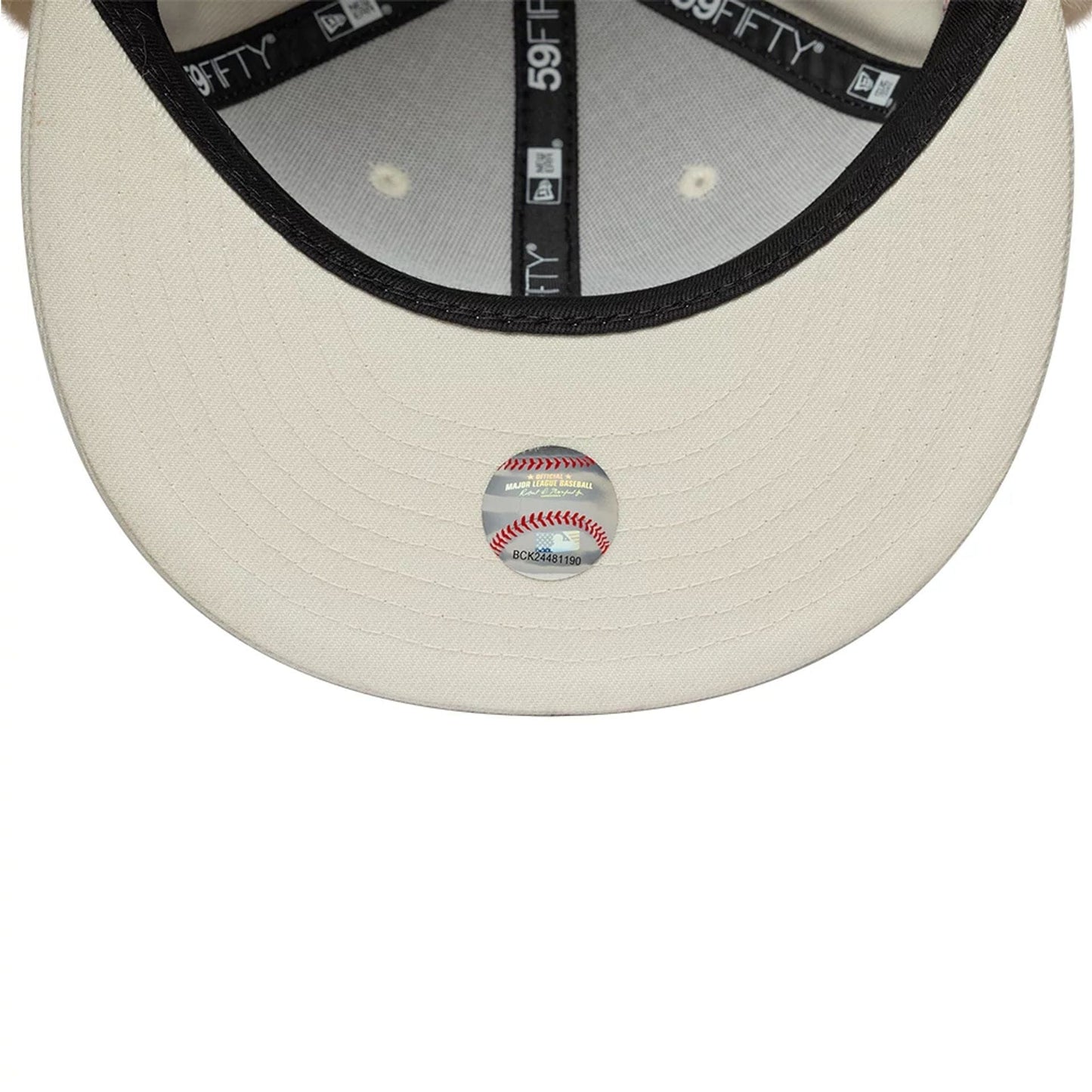 Athletics MLB World Series Cream Dogear New Era 59FIFTY Fitted Cap, inside view featuring black taping with 59FIFTY branding, a black sweatband, cream undervisor, and a central MLB size sticker in red and blue tones.