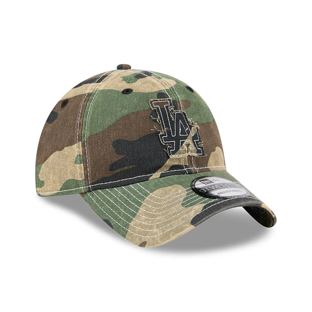 LA Dodgers MLB Washed Camo Open Green New Era 9TWENTY Adjustable Cap, three-quarter view showing a black embroidered LA logo on the front panel, curved visor with 9TWENTY size sticker, and washed camo pattern across the crown.