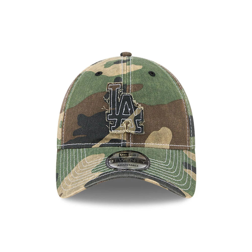 LA Dodgers MLB Washed Camo Open Green New Era 9TWENTY Adjustable Cap, front view showing the distressed black and white embroidered LA logo on the camouflage front panel and the 9TWENTY size sticker on the curved visor.