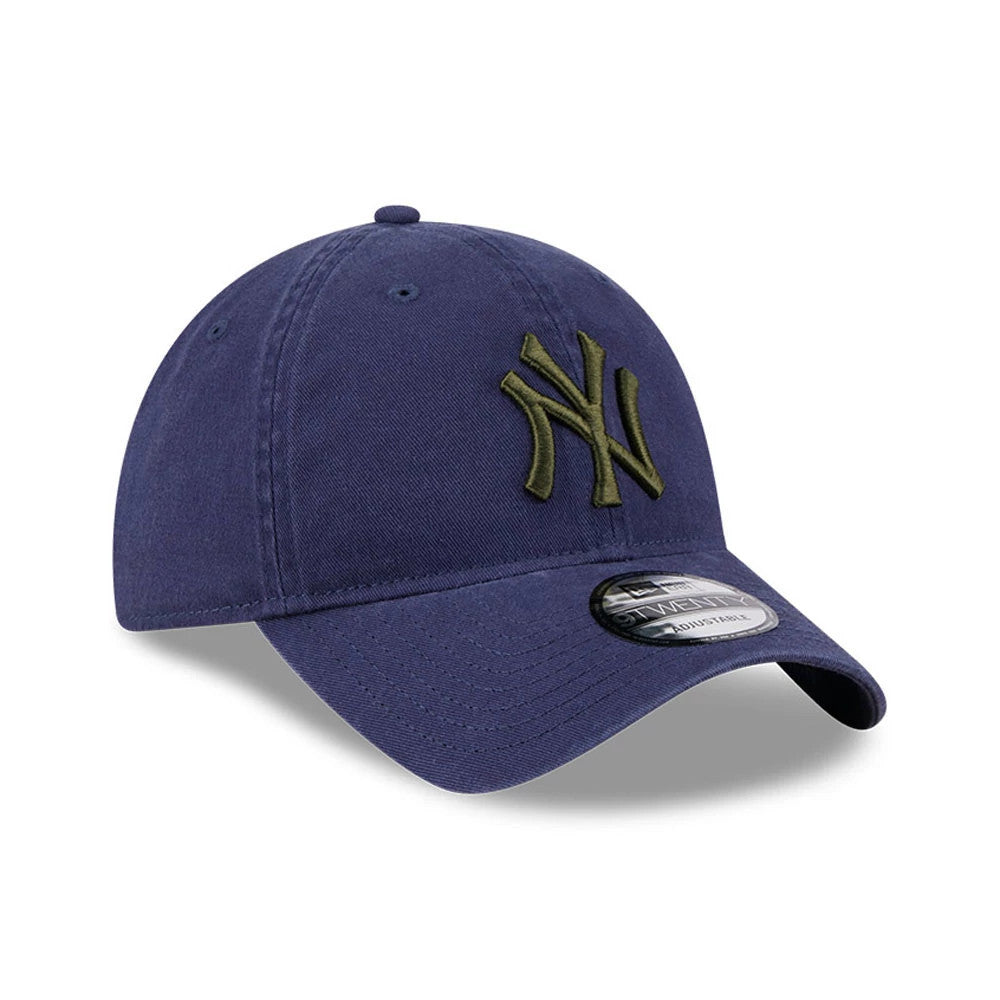 New York Yankees MLB Rifle Green Logo Navy New Era 9TWENTY Adjustable Cap, three-quarter view showing the olive green embroidered NY logo on the front panel, curved navy visor with a 9TWENTY size sticker, and navy top button.