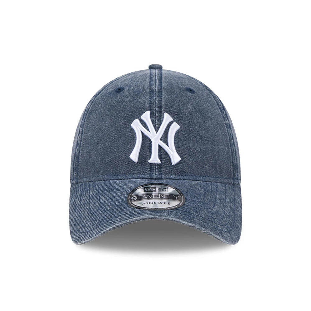New York Yankees MLB Overwash Dark Blue New Era 9TWENTY Adjustable Cap, front view showing the raised white embroidered NY logo on the front panel, curved visor and 9TWENTY size sticker on the denim-style material.