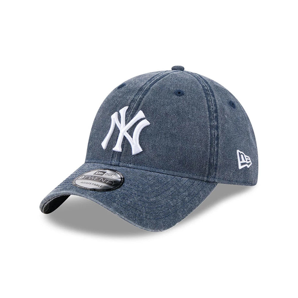 New York Yankees MLB Overwash Dark Blue New Era 9TWENTY Adjustable Cap, three-quarter view showing the raised white NY logo on the front panel, curved dark blue visor with the 9TWENTY size sticker, and New Era flag logo on the left side.