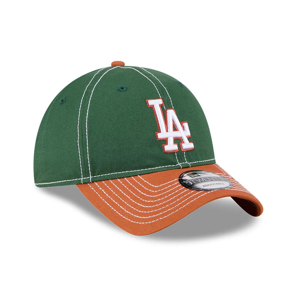 LA Dodgers MLB 2Tone Dark Green New Era 9TWENTY Adjustable Cap, three-quarter view showing a raised white LA logo on the front dark green panel, with an orange curved visor and a 9TWENTY size sticker on the top.
