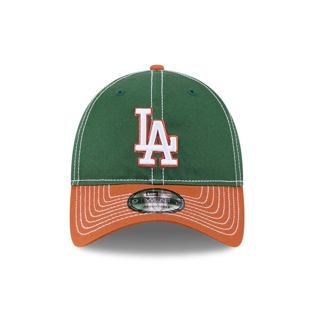LA Dodgers MLB 2Tone Dark Green New Era 9TWENTY Adjustable Cap, front view showing the raised white LA logo with orange outline on the dark green crown, contrasting with the orange curved visor and 9TWENTY size sticker.