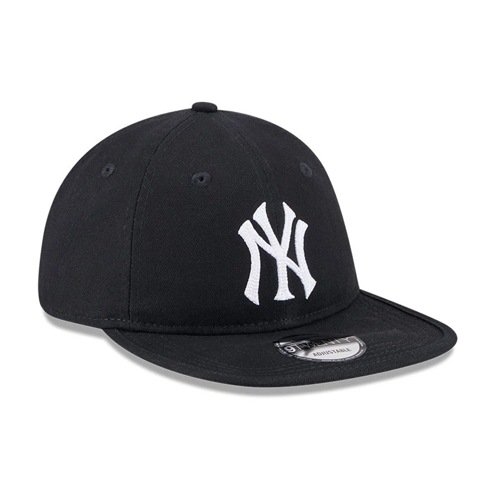 New York Yankees MLB Herringbone Navy New Era 9TWENTY Adjustable Cap, three-quarter view showing the raised white NY logo embroidered on the front panel, with a pre-curved navy visor and a 9TWENTY size sticker on top.