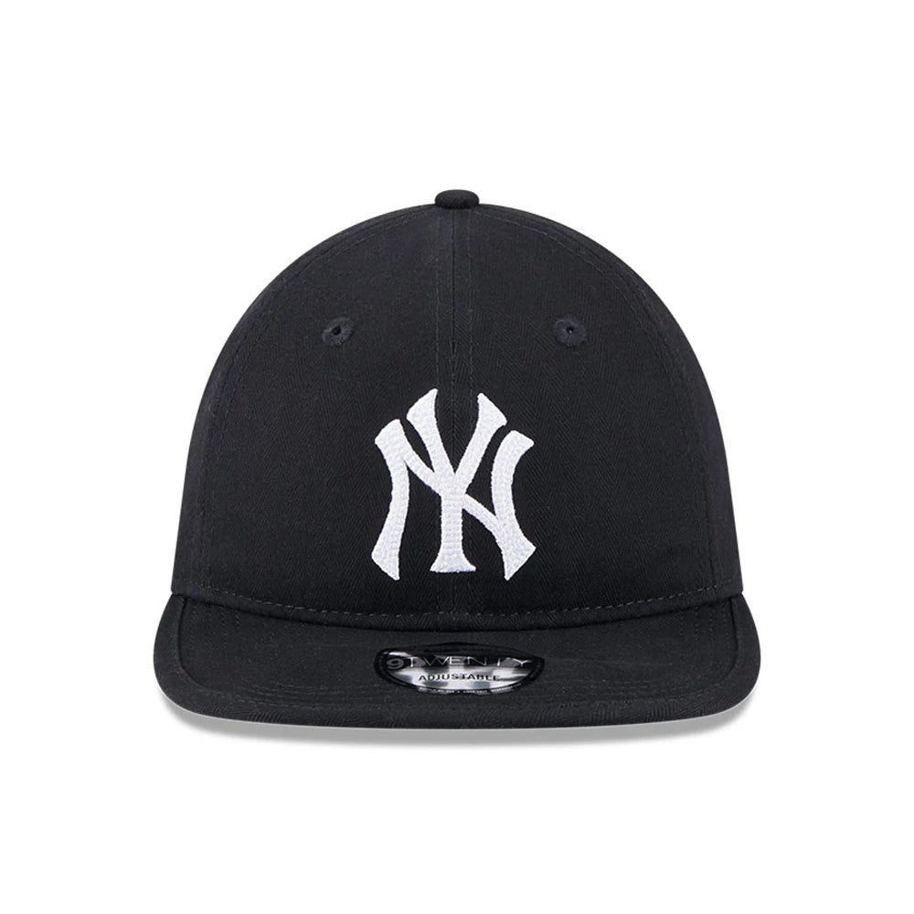 New York Yankees MLB Herringbone Navy New Era 9TWENTY Adjustable Cap, front view showing the white embroidered NY logo on the structured navy crown, with a curved navy visor and size sticker on display.