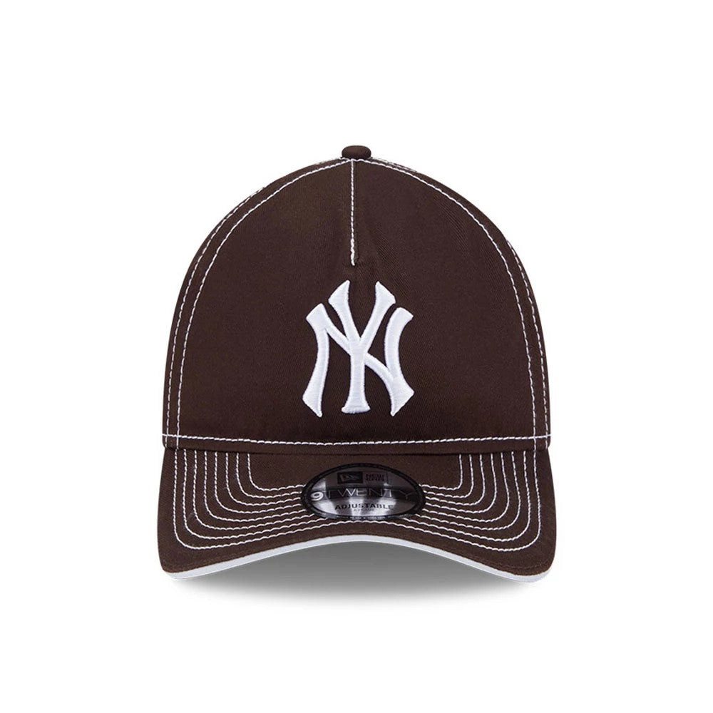 New York Yankees MLB Contrast Dark Brown New Era 9TWENTY A-Frame Adjustable Cap, front view showing the raised white NY logo embroidered on the structured brown crown with contrasting white stitching.