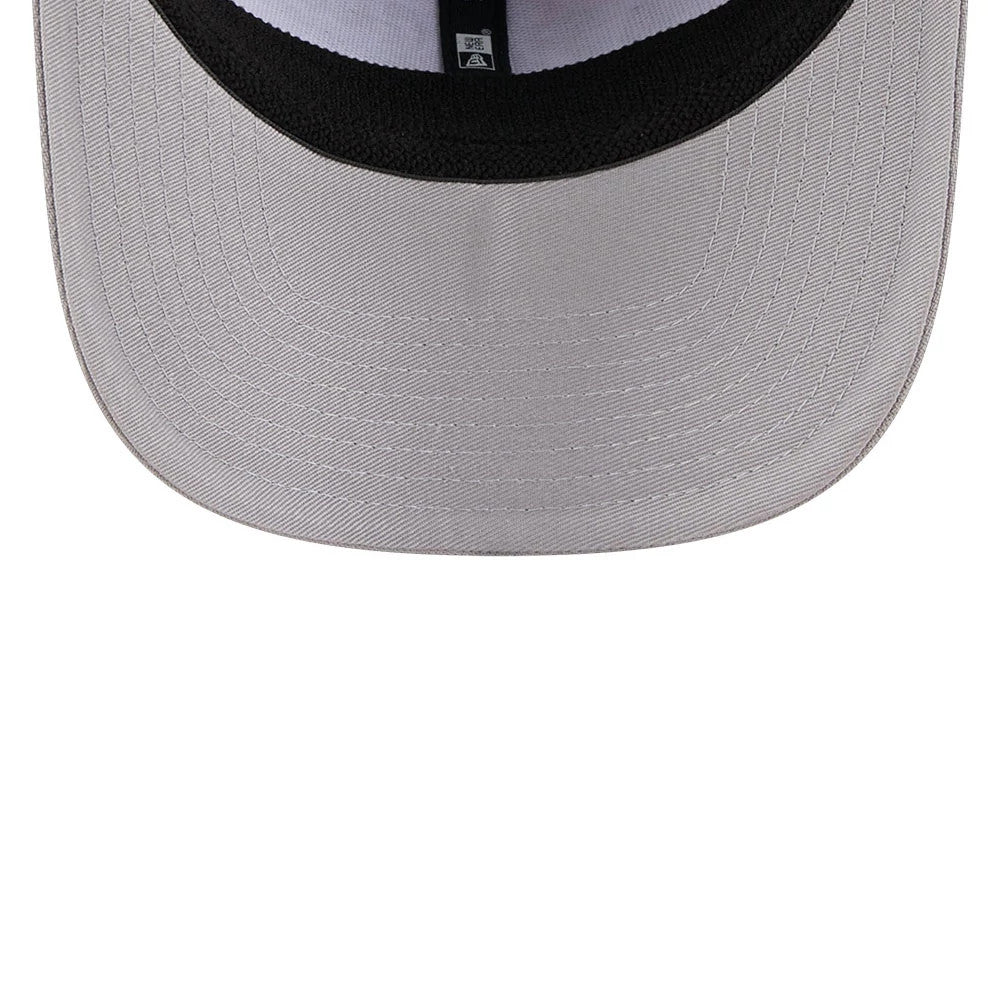 LA Dodgers MLB Script Grey New Era 9SEVENTY Stretch Snap Adjustable Cap, inside view showing the grey undervisor with black taping and a white sweatband, featuring the New Era flag logo on the taping.