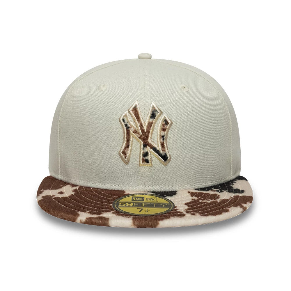 New York Yankees Animal Print Beige New Era 59FIFTY Fitted Cap, front view showing a beige and brown animal print embroidered NY logo on the structured beige crown, with an animal print flat visor and a gold 59FIFTY size sticker on top.