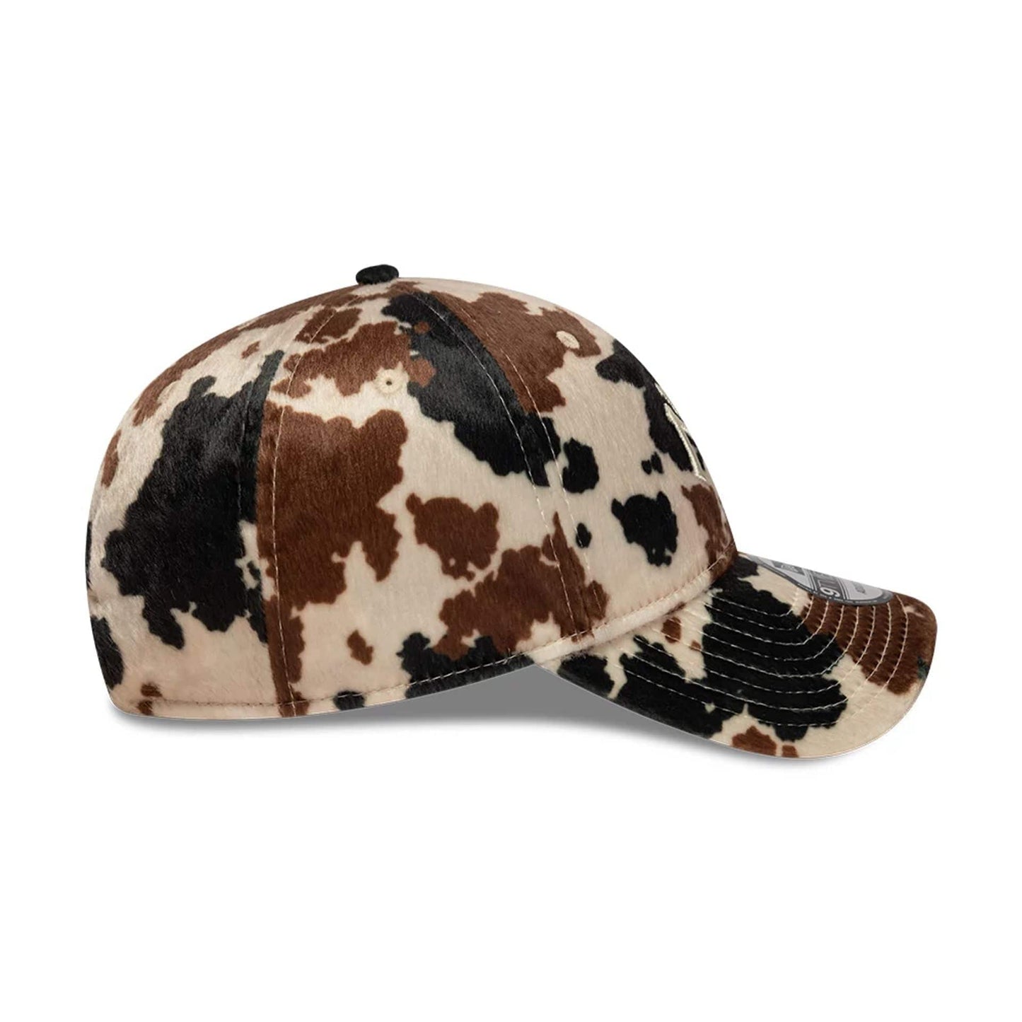 New York Yankees Animal Print Beige New Era 9TWENTY Adjustable Cap, side view showing the brown and black animal print pattern on the six-panel crown and curved visor, with a New Era flag logo on the left side.