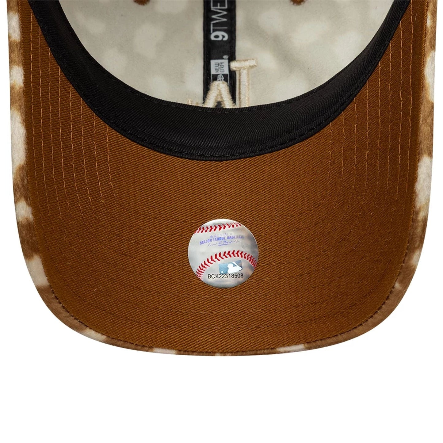 LA Dodgers Animal Print Dark Beige New Era 9TWENTY Adjustable Cap, inside view showing the brown undervisor with a baseball sticker, black sweatband, and beige animal print taping along the seams.