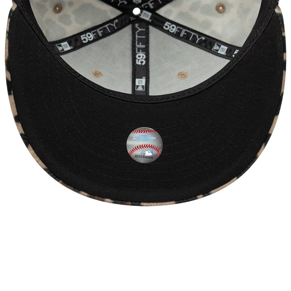 New York Yankees Animal Print Leopard Black New Era 59FIFTY Fitted Cap, inside view showing the leopard print under the black structured crown with black 59FIFTY taping and a black sweatband, featuring an MLB holographic sticker on the undervisor.