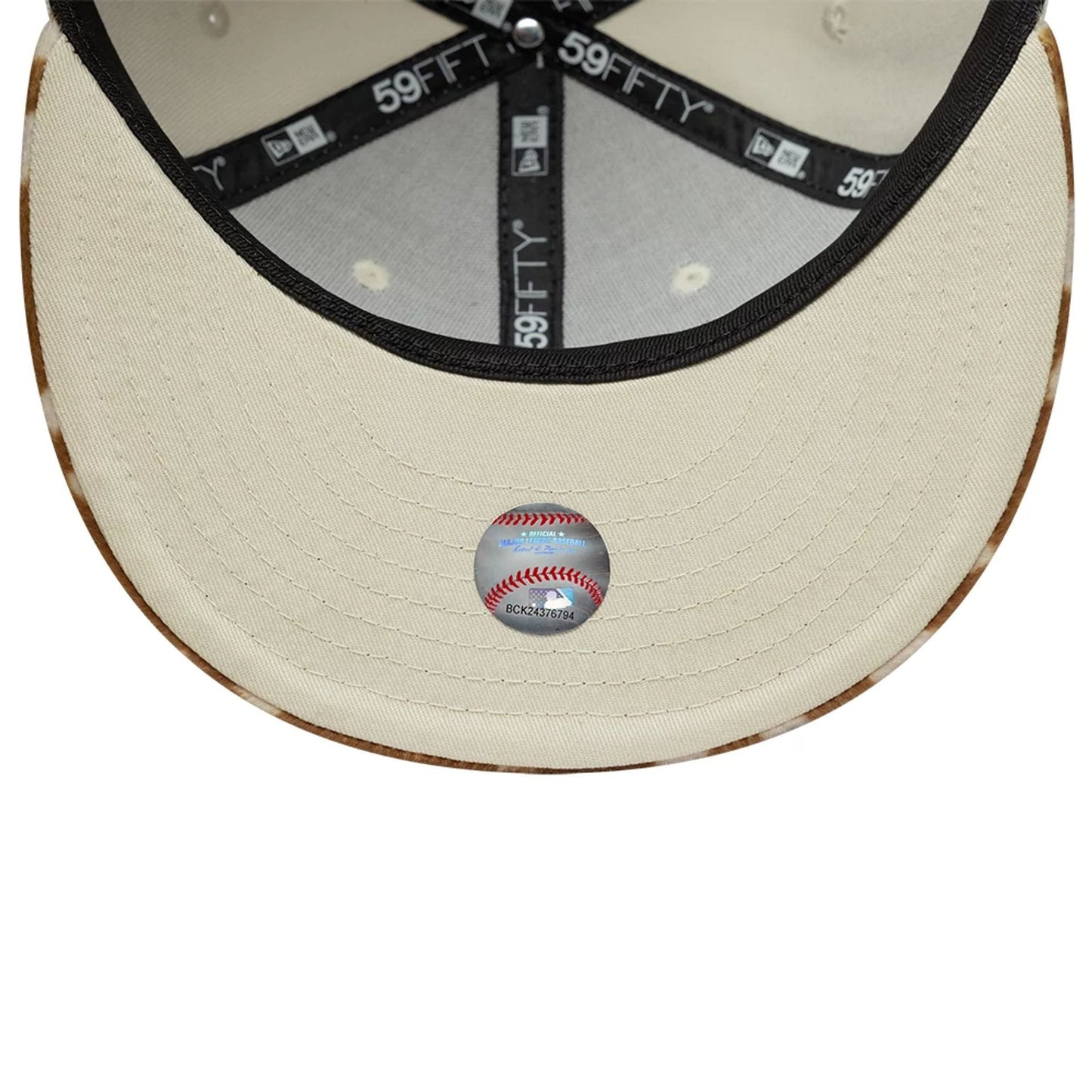 LA Dodgers Animal Print Beige New Era 59FIFTY Fitted Cap, inside view showing the black taping with 59FIFTY branding, a baseball graphics sticker on the beige undervisor, and a pale sweatband beneath the animal print crown.